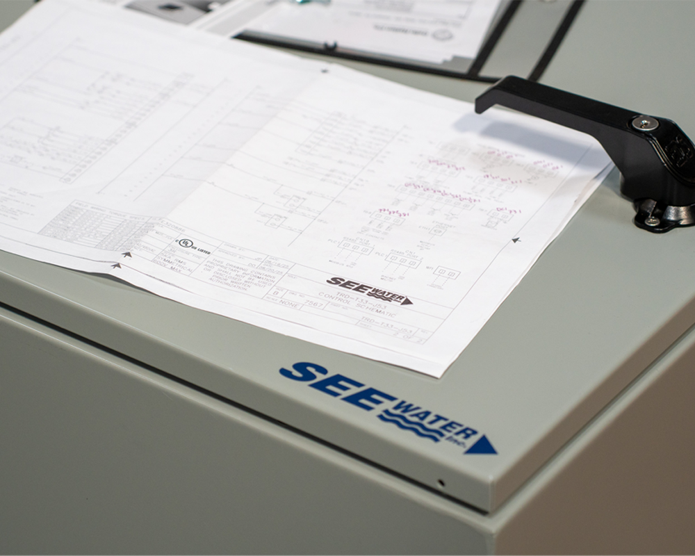 Engineering schematics on top of panel.