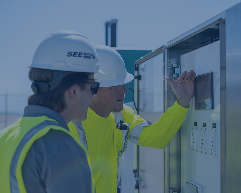 Two men talking about panel and its features.